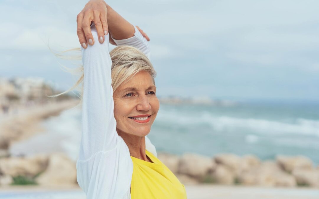 A woman feeling better after treating her rotator cuff tear